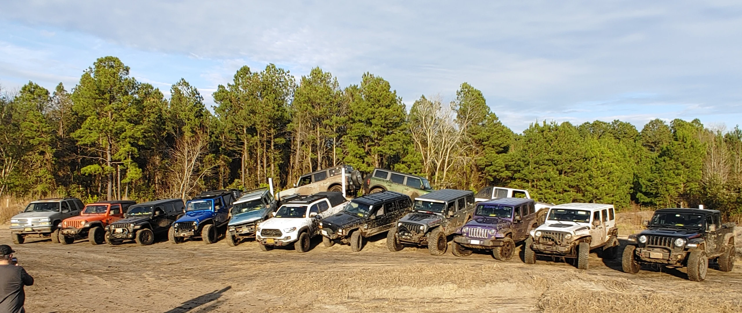 Group of off-road vehicles and drivers at a Where2Wheel trail event
